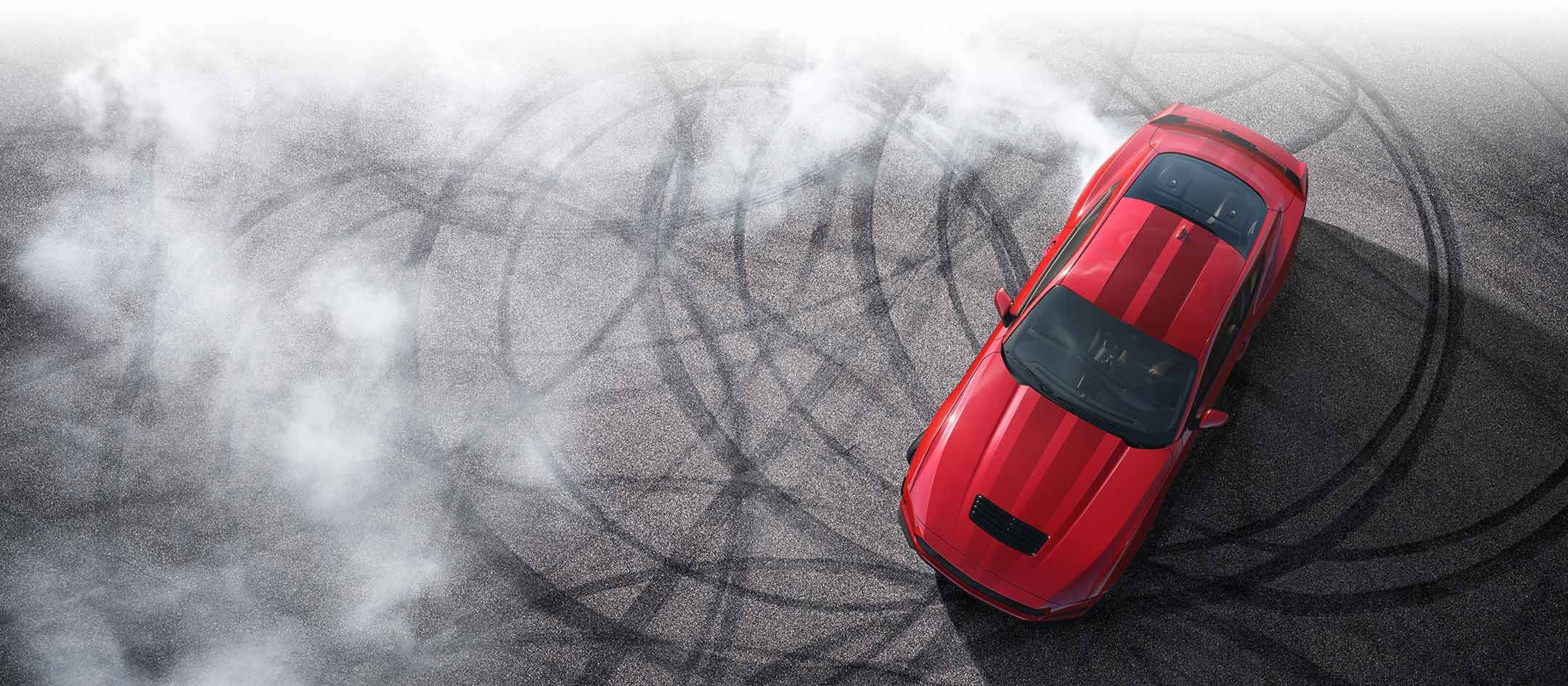 Overhead view of a 2024 Ford Mustang® model with tire tracks on pavement | Ricart Ford in Groveport OH