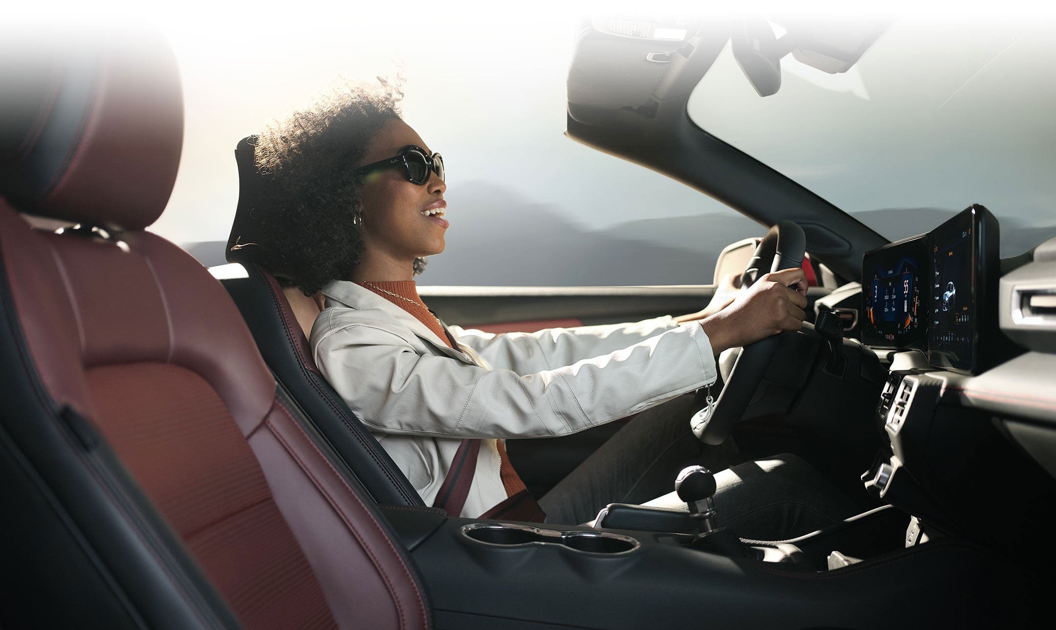 Person sitting in the driver’s seat of a 2024 Ford Mustang® convertible | Ricart Ford in Groveport OH