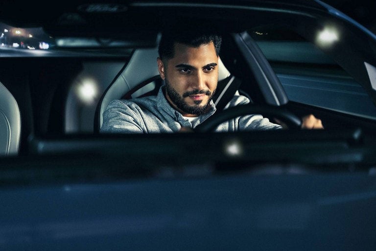 Person sitting in the driver’s seat of a parked 2024 Ford Mustang® coupe | Ricart Ford in Groveport OH