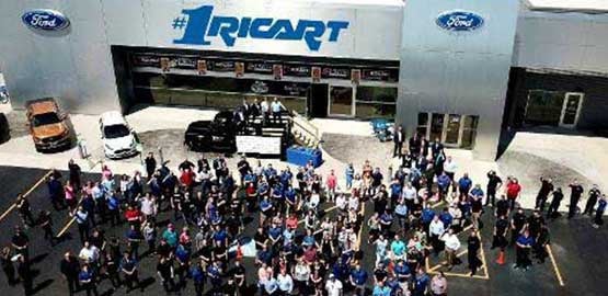 Crowd watching presentation of Triple Crown Award